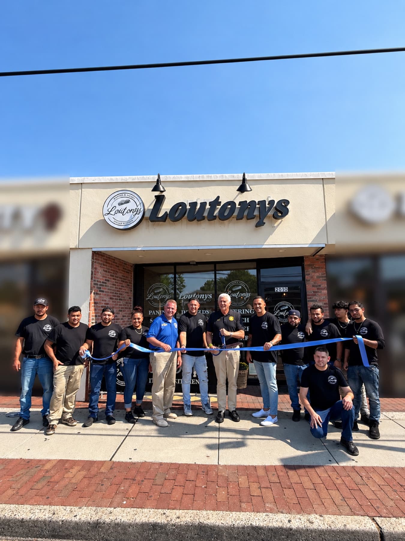 LouTony's ribbon cutting with the team and Nassau County officials